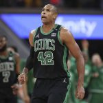 Boston Celtics center Al Horford (42) reacts after scoring against the Golden State Warriors during the second half of Game 5 of basketball's NBA Finals in San Francisco, Monday, June 13, 2022. (AP Photo/Jed Jacobsohn)