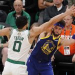 Golden State Warriors guard Klay Thompson (11) looks to pass against the Boston Celtics forward Jayson Tatum (0) during the third quarter of Game 6 of basketball's NBA Finals, Thursday, June 16, 2022, in Boston. (AP Photo/Michael Dwyer)