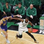 Boston Celtics guard Jaylen Brown (7) drives against Golden State Warriors guard Klay Thompson (11) during the second quarter of Game 6 of basketball's NBA Finals, Thursday, June 16, 2022, in Boston. (AP Photo/Michael Dwyer)
