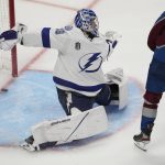 Tampa Bay Lightning goaltender Andrei Vasilevskiy gives up goal on a shot from Colorado Avalanche left wing Andre Burakovsky, not seen, during overtime in Game 1 of the NHL hockey Stanley Cup Final on Wednesday, June 15, 2022, in Denver. (AP Photo/David Zalubowski)