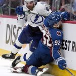 Colorado Avalanche left wing Gabriel Landeskog (92) collides with Tampa Bay Lightning defenseman Erik Cernak (81) during the second period of Game 1 of the NHL hockey Stanley Cup Final on Wednesday, June 15, 2022, in Denver. (AP Photo/John Locher)