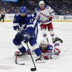 Tampa Bay Lightning left wing Alex Killorn (17) gets around New York Rangers center Barclay Goodrow (21) during the second period in Game 6 of the NHL hockey Stanley Cup playoffs Eastern Conference finals, Saturday, June 11, 2022, in Tampa, Fla. (AP Photo/Chris O'Meara)