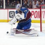 Colorado Avalanche goaltender Darcy Kuemper (35) blocks a Tampa Bay Lightning shot during the second period of Game 1 of the NHL hockey Stanley Cup Final on Wednesday, June 15, 2022, in Denver. (AP Photo/John Locher)