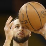 Golden State Warriors guard Stephen Curry warms up before Game 5 of basketball's NBA Finals against the Boston Celtics in San Francisco, Monday, June 13, 2022. (AP Photo/Jed Jacobsohn)