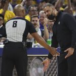 Boston Celtics head coach Ime Udoka, right, gestures toward referee Marc Davis during the first half of his team's Game 5 of basketball's NBA Finals against the Golden State Warriors in San Francisco, Monday, June 13, 2022. (AP Photo/Jed Jacobsohn)