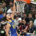Golden State Warriors guard Stephen Curry (30) puts up a shot against the Boston Celtics during the third quarter of Game 6 of basketball's NBA Finals, Thursday, June 16, 2022, in Boston. (AP Photo/Steven Senne)