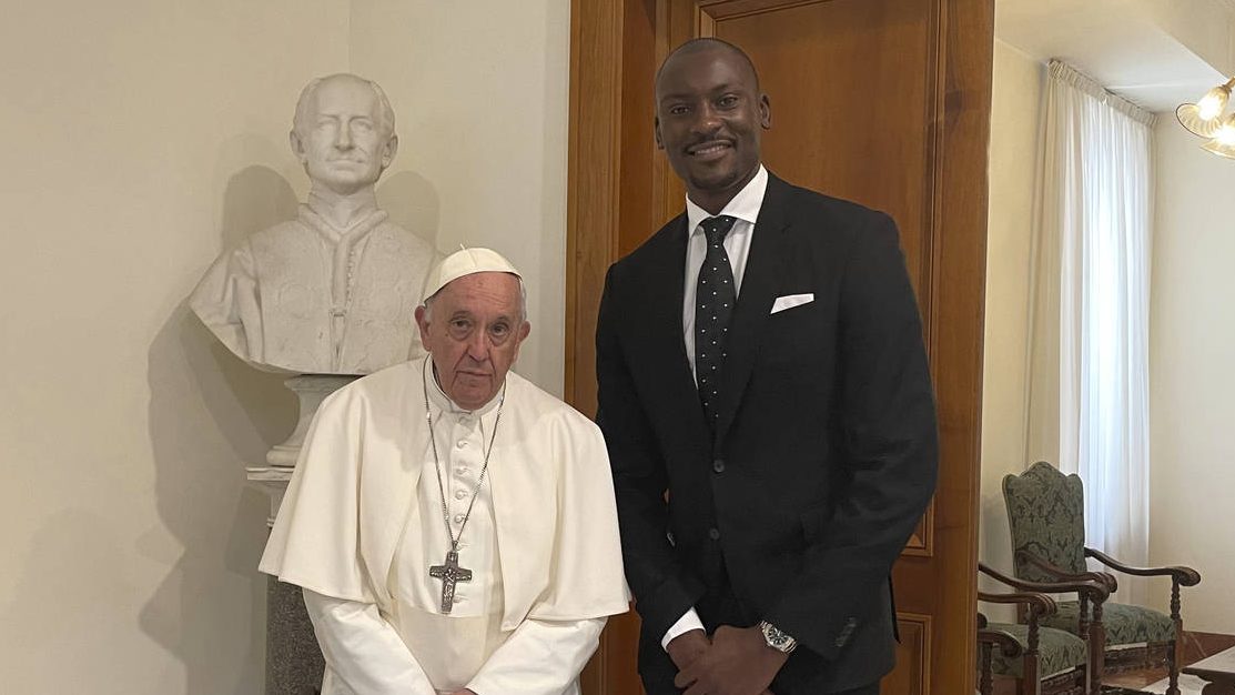 Pope Francis poses with Congolese-born NBA player with the Phoenix Suns Bismack Biyombo as they mee...