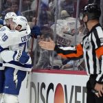 Tampa Bay Lightning left wing Nicholas Paul, left, celebrates his goal against the Colorado Avalanche with center Ross Colton (79) during the first period of Game 1 of the NHL hockey Stanley Cup Final on Wednesday, June 15, 2022, in Denver. (AP Photo/John Locher)