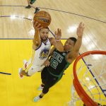 Golden State Warriors guard Stephen Curry (30) shoots against Boston Celtics forward Grant Williams (12) during the first half of Game 5 of basketball's NBA Finals in San Francisco, Monday, June 13, 2022. (AP Photo/Jed Jacobsohn, Pool)