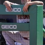Arizona Diamondbacks manager Torey Lovullo stands in the dugout during the first inning of a baseball game against the Pittsburgh Pirates in Pittsburgh, Saturday, June 4, 2022. (AP Photo/Gene J. Puskar)