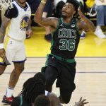 Boston Celtics guard Marcus Smart (36) shoots against the Golden State Warriors during the second half of Game 5 of basketball's NBA Finals in San Francisco, Monday, June 13, 2022. (AP Photo/John Hefti)