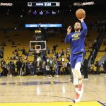 Golden State Warriors guard Stephen Curry warms up before Game 5 of basketball's NBA Finals against the Boston Celtics in San Francisco, Monday, June 13, 2022. (AP Photo/Jed Jacobsohn)