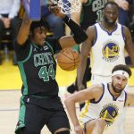 Boston Celtics center Robert Williams III (44) dunks against the Golden State Warriors during the second half of Game 5 of basketball's NBA Finals in San Francisco, Monday, June 13, 2022. (AP Photo/John Hefti)