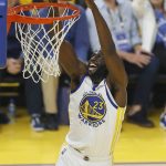 Golden State Warriors forward Draymond Green (23) dunks against the Boston Celtics during the first half of Game 5 of basketball's NBA Finals in San Francisco, Monday, June 13, 2022. (AP Photo/John Hefti)