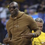 Former NFL football player Terrell Owens gestures during Game 5 of basketball's NBA Finals between the Golden State Warriors and the Boston Celtics in San Francisco, Monday, June 13, 2022. (AP Photo/Jed Jacobsohn)