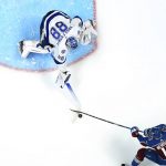 Tampa Bay Lightning goaltender Andrei Vasilevskiy (88) blocks a shot by Colorado Avalanche right wing Valeri Nichushkin (13) during the third period of Game 1 of the NHL hockey Stanley Cup Final on Wednesday, June 15, 2022, in Denver. (AP Photo/John Locher)