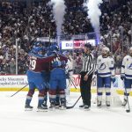 Colorado Avalanche left wing Gabriel Landeskog (92) celebrates a goal against the Tampa Bay Lightning with teammates, including Nathan MacKinnon (29) and Mikko Rantanen (96), during the first period of Game 1 of the NHL hockey Stanley Cup Final on Wednesday, June 15, 2022, in Denver. (AP Photo/John Locher)