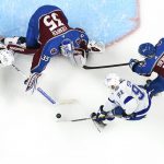 Colorado Avalanche goaltender Darcy Kuemper (35) blocks a shot by Tampa Bay Lightning center Steven Stamkos (91) during the overtime in Game 1 of the NHL hockey Stanley Cup Final on Wednesday, June 15, 2022, in Denver. (AP Photo/John Locher)