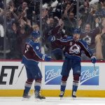Colorado Avalanche right wing Valeri Nichushkin (13) celebrates his goal against the Tampa Bay Lightning with Cale Makar (8) during the first period of Game 1 of the NHL hockey Stanley Cup Final on Wednesday, June 15, 2022, in Denver. (AP Photo/John Locher )