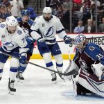 Colorado Avalanche goaltender Darcy Kuemper (35) stops a shot from Tampa Bay Lightning center Ross Colton (79) during the third period of Game 1 of the NHL hockey Stanley Cup Final on Wednesday, June 15, 2022, in Denver. (AP Photo/John Locher)