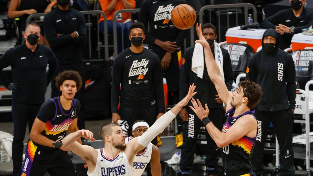 Dario Saric #20 of the Phoenix Suns puts up a shot over Ivica Zubac #40 of the LA Clippers during t...