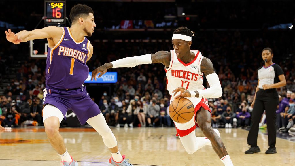 Dennis Schroder #17 of the Houston Rockets handles the ball against Devin Booker #1 of the Phoenix ...