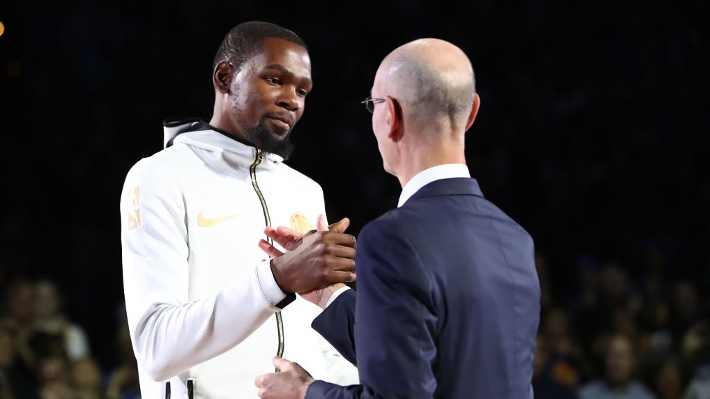 Kevin Durant #35 of the Golden State Warriors greets NBA commissioner Adam Silver prior to their ga...