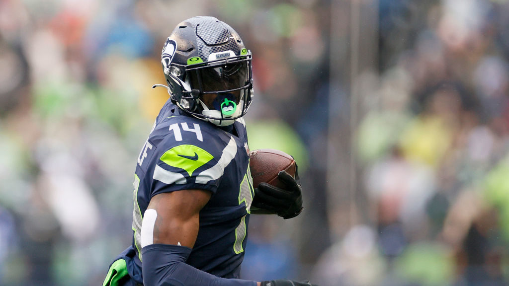 DK Metcalf #14 of the Seattle Seahawks carries the ball against the Detroit Lions during the first ...