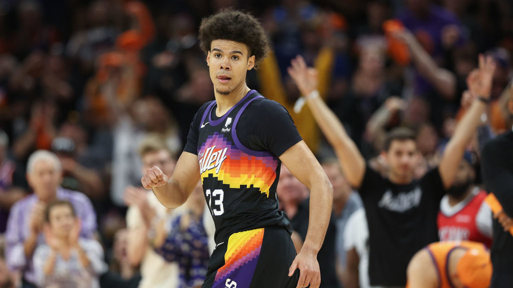 Cameron Johnson #23 of the Phoenix Suns reacts after hitting a three-point shot against the New Orl...