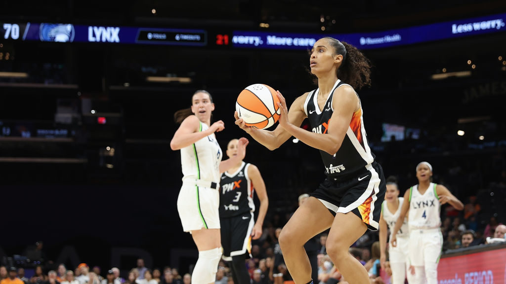 Skylar Diggins-Smith #4 of the Phoenix Mercury attempts a shot against the Minnesota Lynx during th...