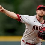 Starting pitcher Merrill Kelly #29 of the Arizona Diamondbacks throws against the Colorado Rockies in the first inning at Coors Field on July 01, 2022 in Denver, Colorado. (Photo by Matthew Stockman/Getty Images)
