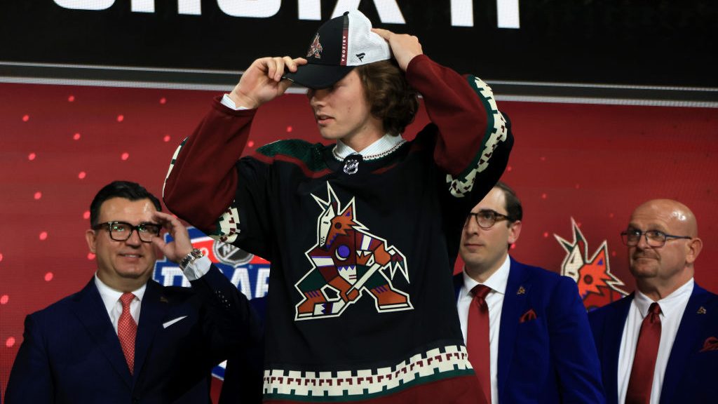 Conor Geekie is drafted by the Arizona Coyotes during Round One of the 2022 Upper Deck NHL Draft at...