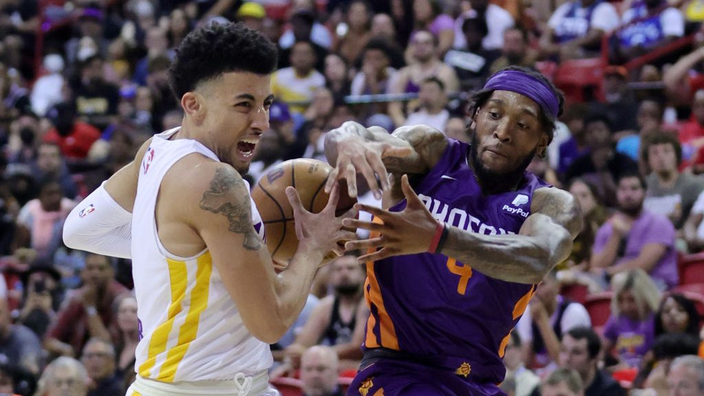 Scotty Pippen Jr. #1 of the Los Angeles Lakers is fouled by Ahmad Caver #4 of the Phoenix Suns duri...