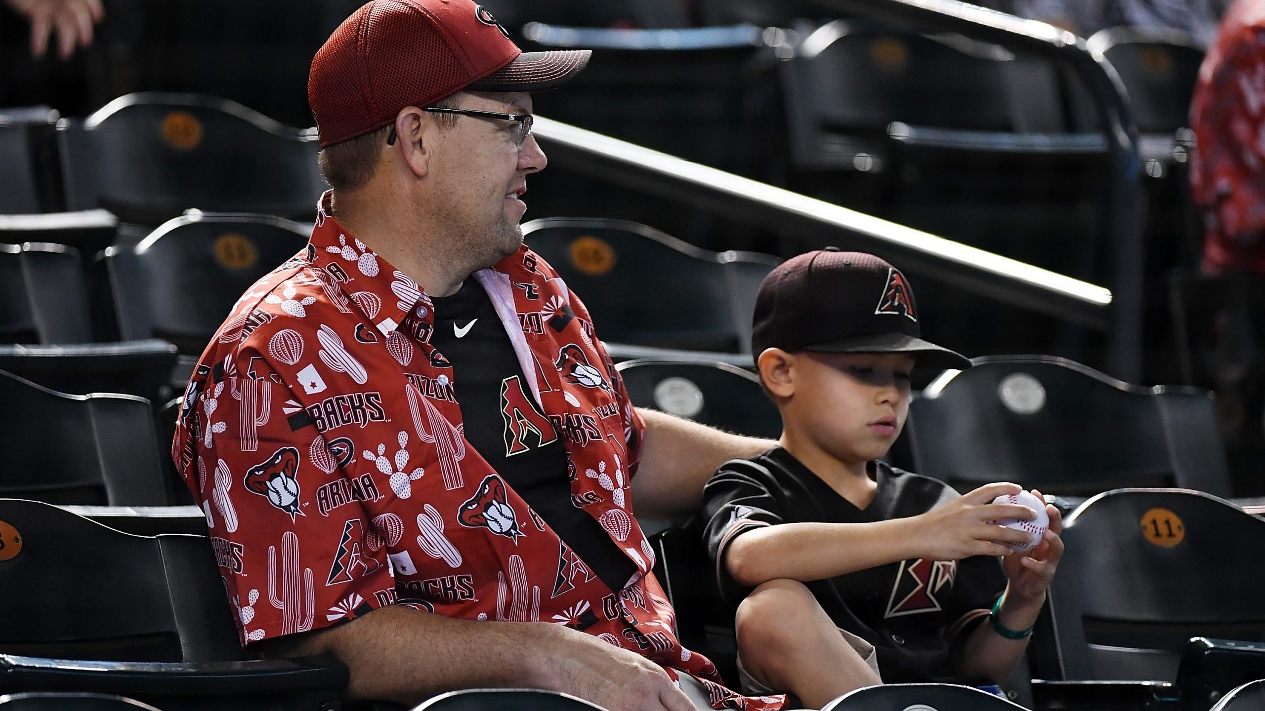Fans get ready for a game between the Arizona Diamondbacks and the New York Mets at Chase Field on ...