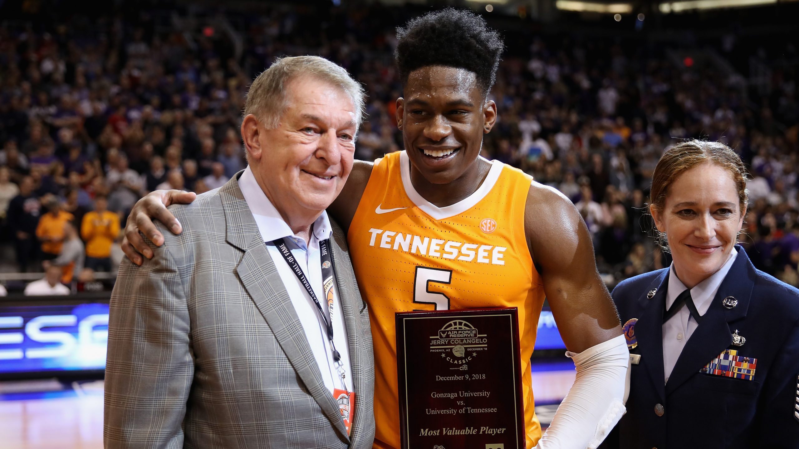 Admiral Schofield #5 of the Tennessee Volunteers is awarded the MVP trophy from Jerry Colangelo fol...