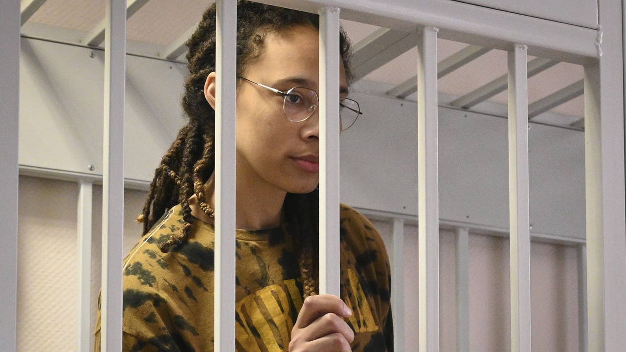 WNBA star and two-time Olympic gold medalist Brittney Griner stands in a cage at a court room prior...