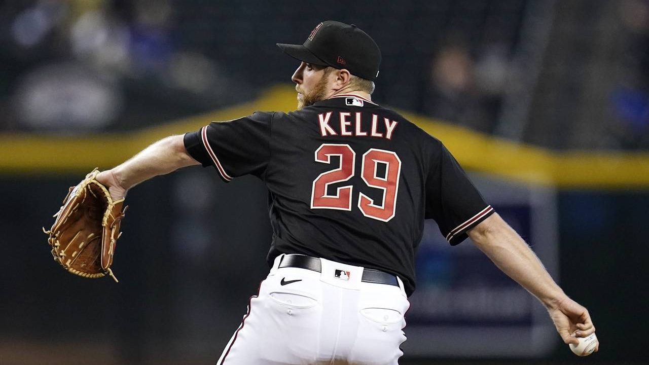 Arizona Diamondbacks starting pitcher Merrill Kelly throws to a San Francisco Giants batter during ...