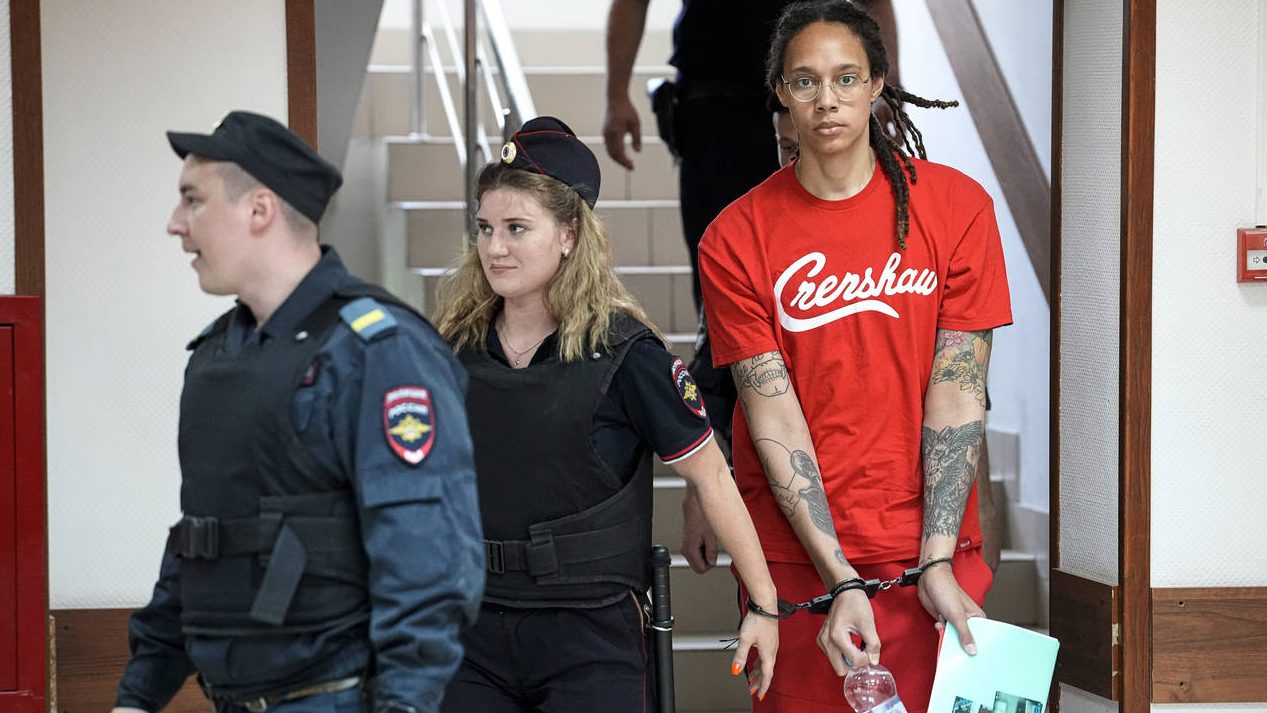 WNBA star and two-time Olympic gold medalist Brittney Griner is escorted to a courtroom for a heari...