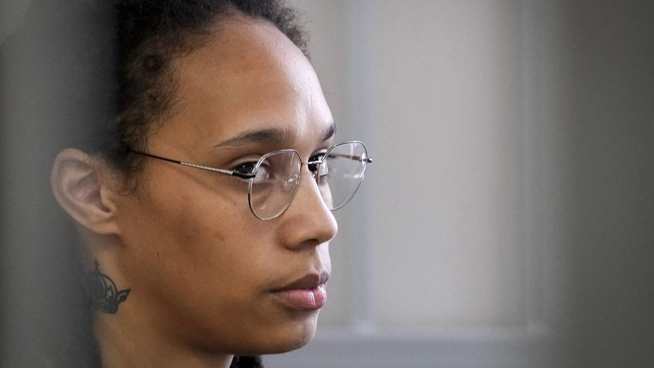 WNBA star and two-time Olympic gold medalist Brittney Griner sits in a cage at a court room prior t...