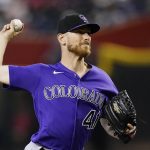 Colorado Rockies starting pitcher Chad Kuhl throws to an Arizona Diamondbacks batter during the first inning of a baseball game Friday, July 8, 2022, in Phoenix. (AP Photo/Ross D. Franklin)