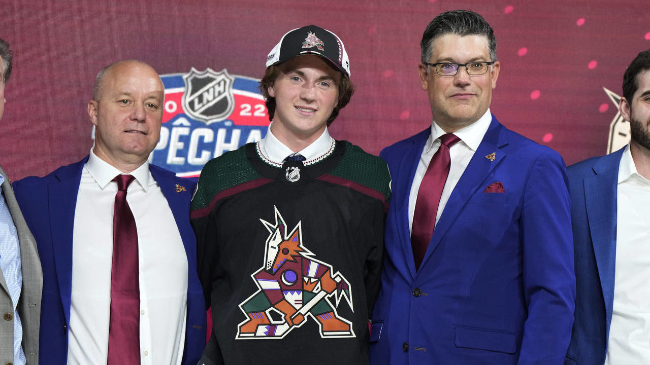 Logan Cooley poses for photos after being selected by the Arizona Coyotes with the third pick in th...