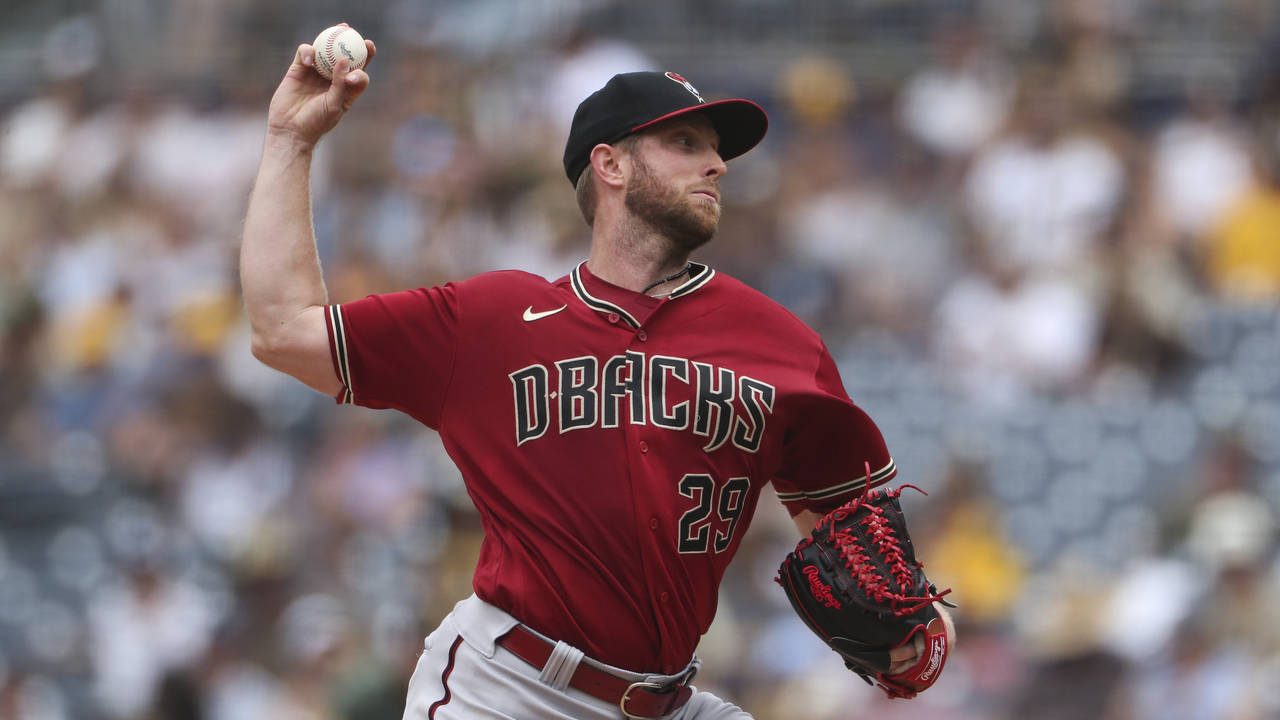 Arizona Diamondbacks' Merrill Kelly delivers a pitch to a San Diego Padres batter in the first inni...