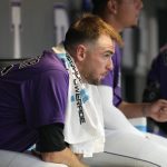 Colorado Rockies starting pitcher Austin Gomber looks on from the dugout in the third inning of a baseball game against the Arizona Diamondbacks, Saturday, July 2, 2022, in Denver. (AP Photo/David Zalubowski)