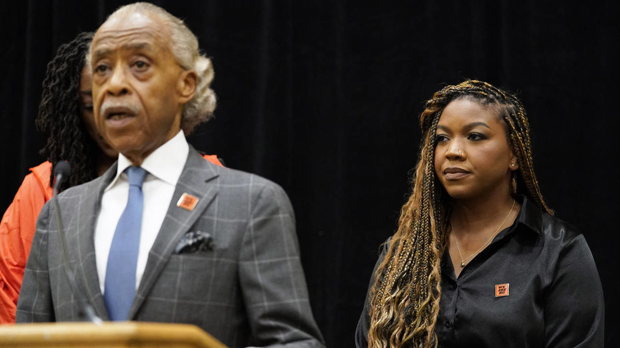 Cherelle Griner, right, listens to the Rev. Al Sharpton during a news conference in Chicago, Friday...