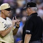 Arizona Diamondbacks manager Torey Lovullo, left, argues with umpire Paul Emmel during the fifth inning of the team's baseball game against the Colorado Rockies on Friday, July 8, 2022, in Phoenix. (AP Photo/Ross D. Franklin)