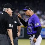 Colorado Rockies manager Bud Black (10) yells at umpires Paul Emmel (50) and Bruce Dreckman during the fifth inning of the team's baseball game against the Arizona Diamondbacks on Friday, July 8, 2022, in Phoenix. (AP Photo/Ross D. Franklin)