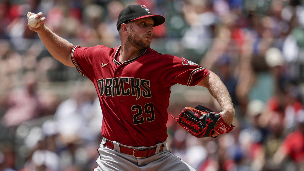 Arizona Diamondbacks' Merrill Kelly pitches against the Atlanta Braves during the first inning of a...