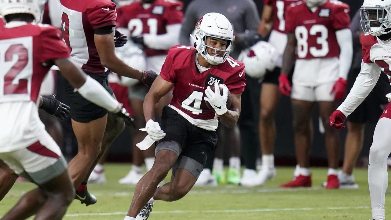 Arizona Cardinals wide receiver Rondale Moore (4) runs with the ball after making a catch as he tak...