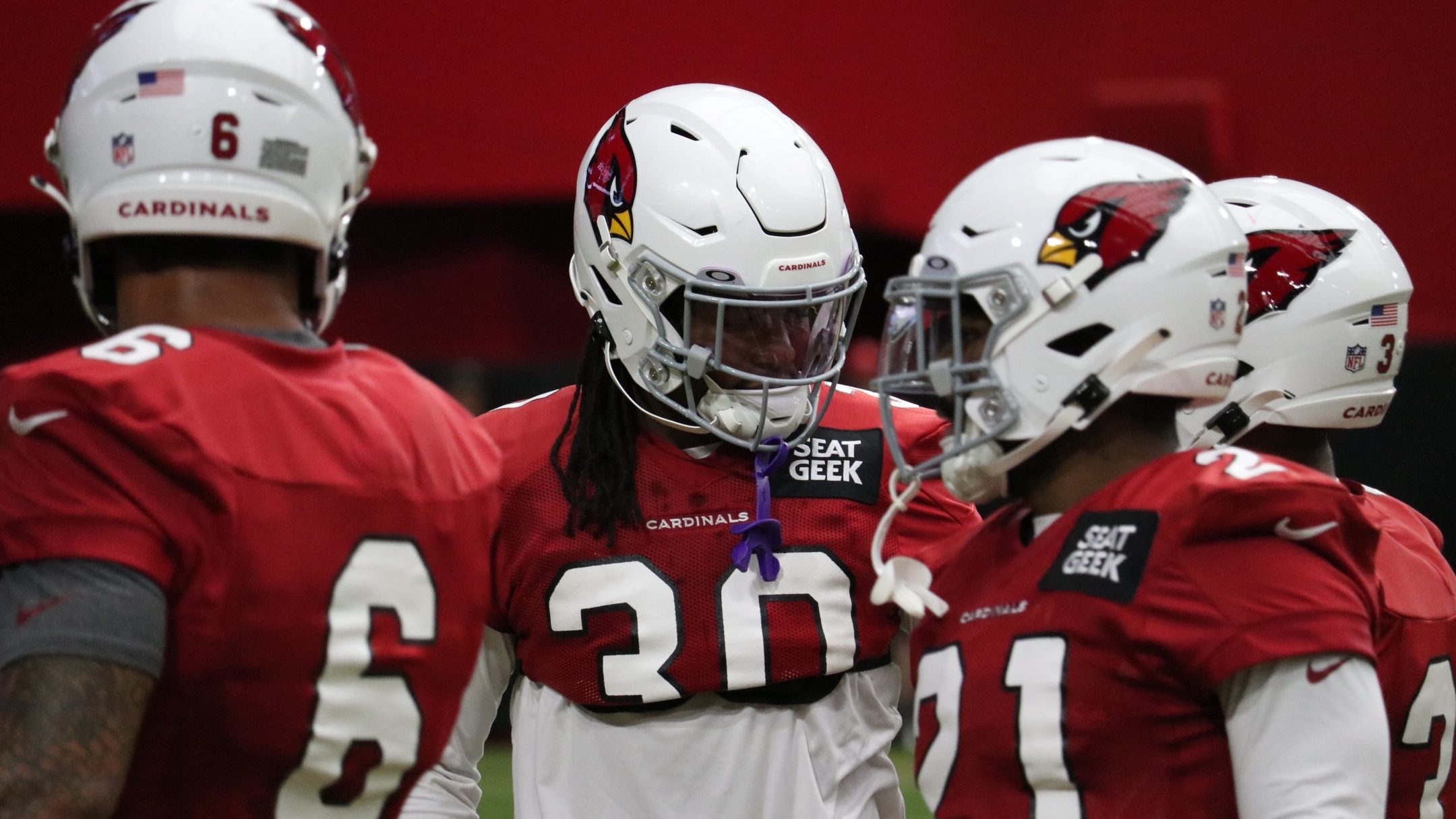 Arizona Cardinals RB Keaontay Ingram (30) chats with members of the RBs room during training camp o...