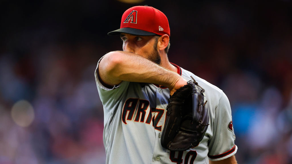 Madison Bumgarner #40 of the Arizona Diamondbacks reacts at the end of the third inning against the...